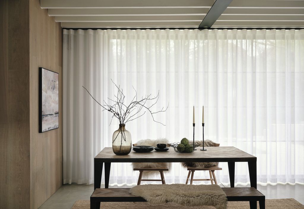 Dining area with sheer Wave curtains on a black 5600 track, oak panelling