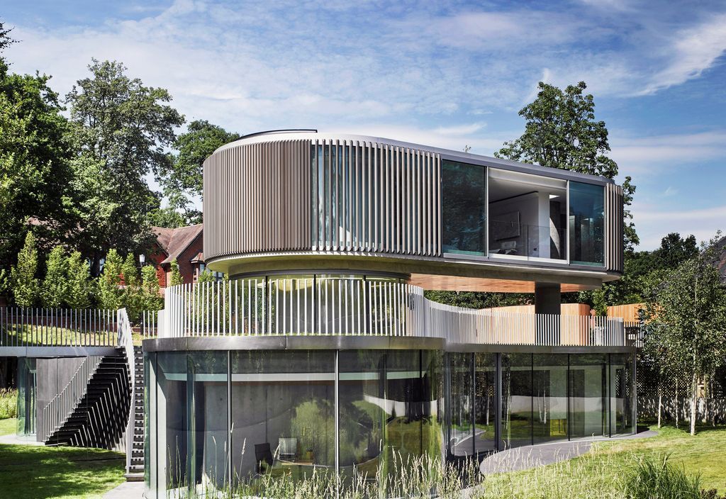 Coombe Park exterior — curved glass facade with timber louvres