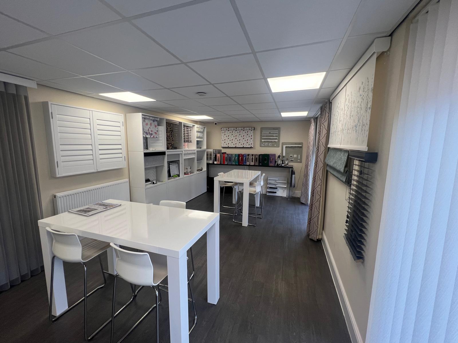 Haywoods showroom with consultation tables, fabric samples and blind displays