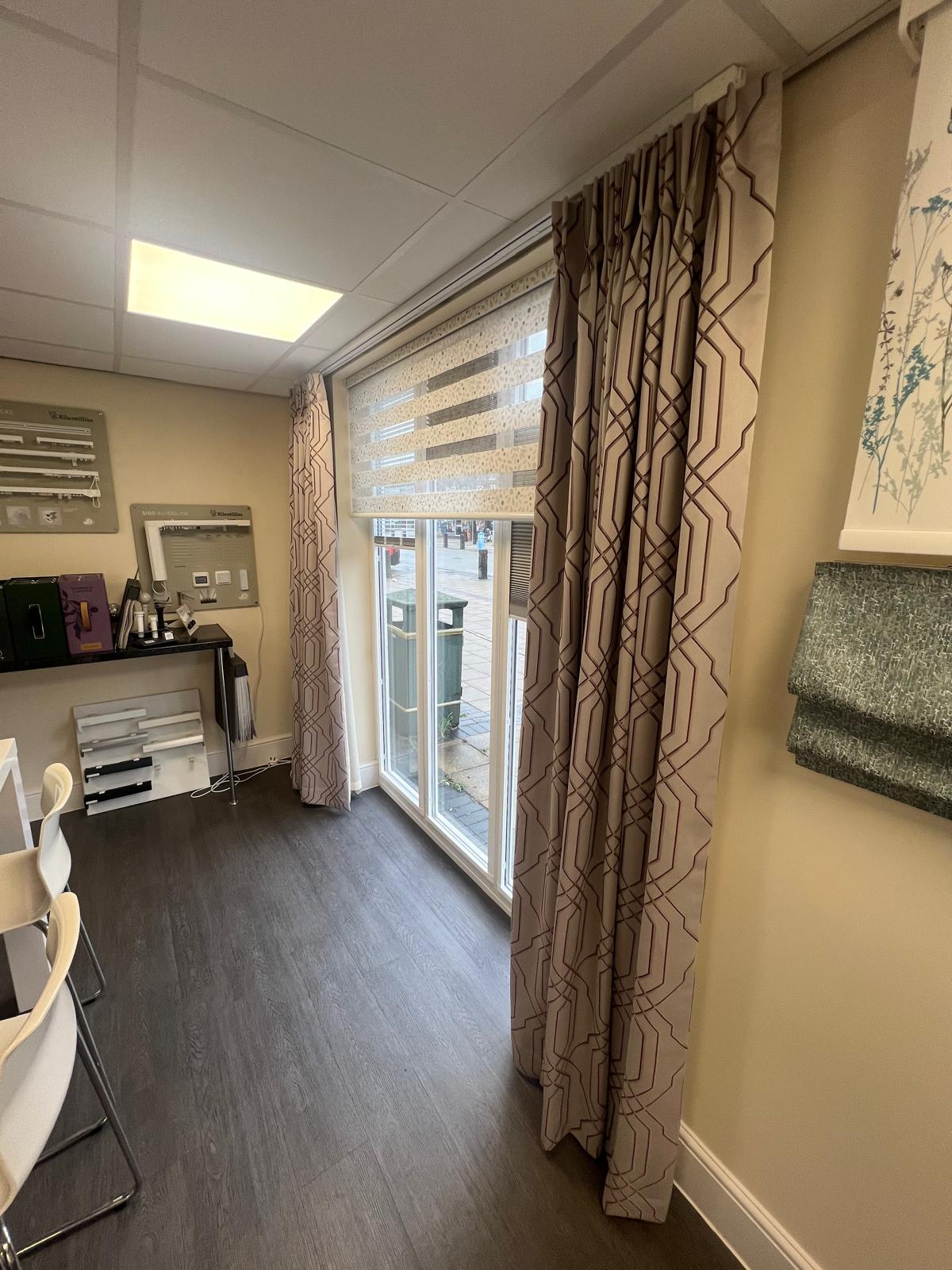 Electric curtains and vision blind on display at the showroom window