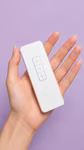 Remote control held in hand
